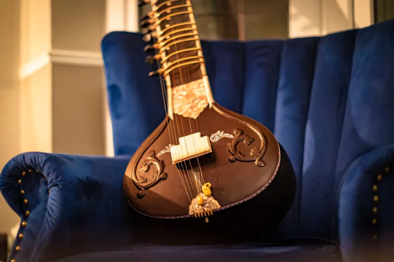 The Drone Beneath the Playlist: Tanpura, Silence, and America's New Hunger for Sustained Sound